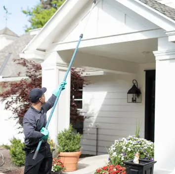 Hawx technician treating exterior eaves