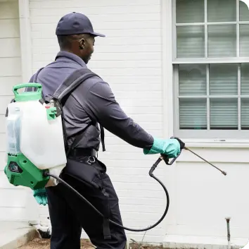 Hawx technician spraying foundation perimeter